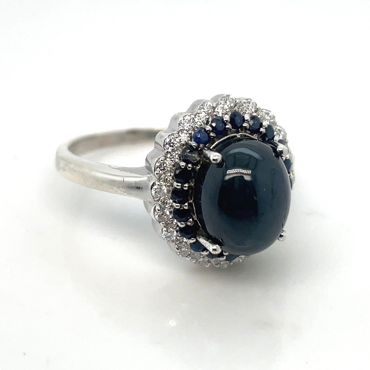 Round White Cubic Zirconia, Round Blue Sapphire, Central Cabochon Cut Sapphire Stone in Silver Ring